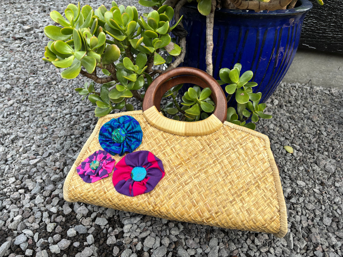 Lauhala Pua ‘Eke Trapeze Handbag - purple, turquoise, and magenta