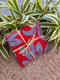 Medium Hand-sewn 2 Piece Coaster - Set 25, pattern 25A: fabric side tied with a lauhala twine bow